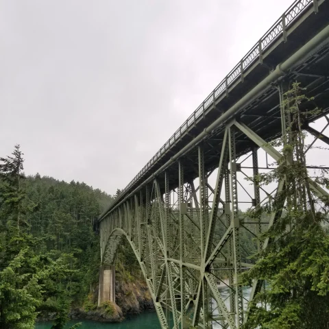 Deception Pass Bridge is an iconic steel marvel spanning the dramatic tidal strait of Deception Pass in Washington State, offering breathtaking views of the Pacific Northwest's rugged beauty.