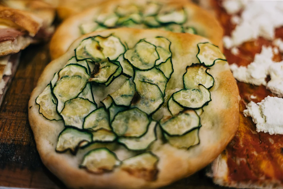 Italian pizza in Rome with courgettes on top.
