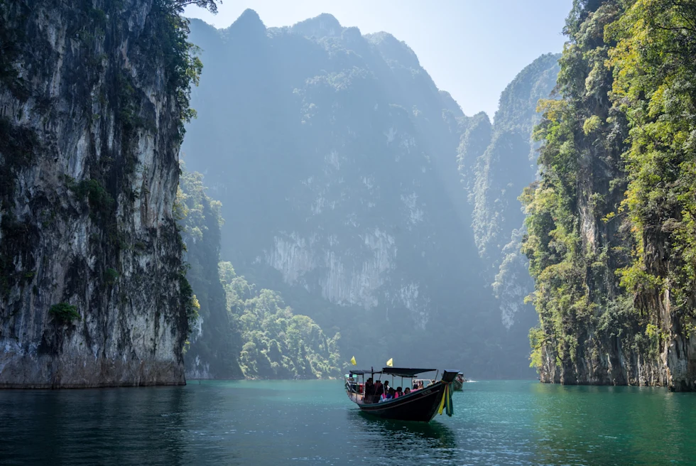Beautiful island with a Thai boat in the water.
