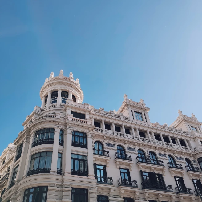 A white building with blue sky in Madrid, Spain.
