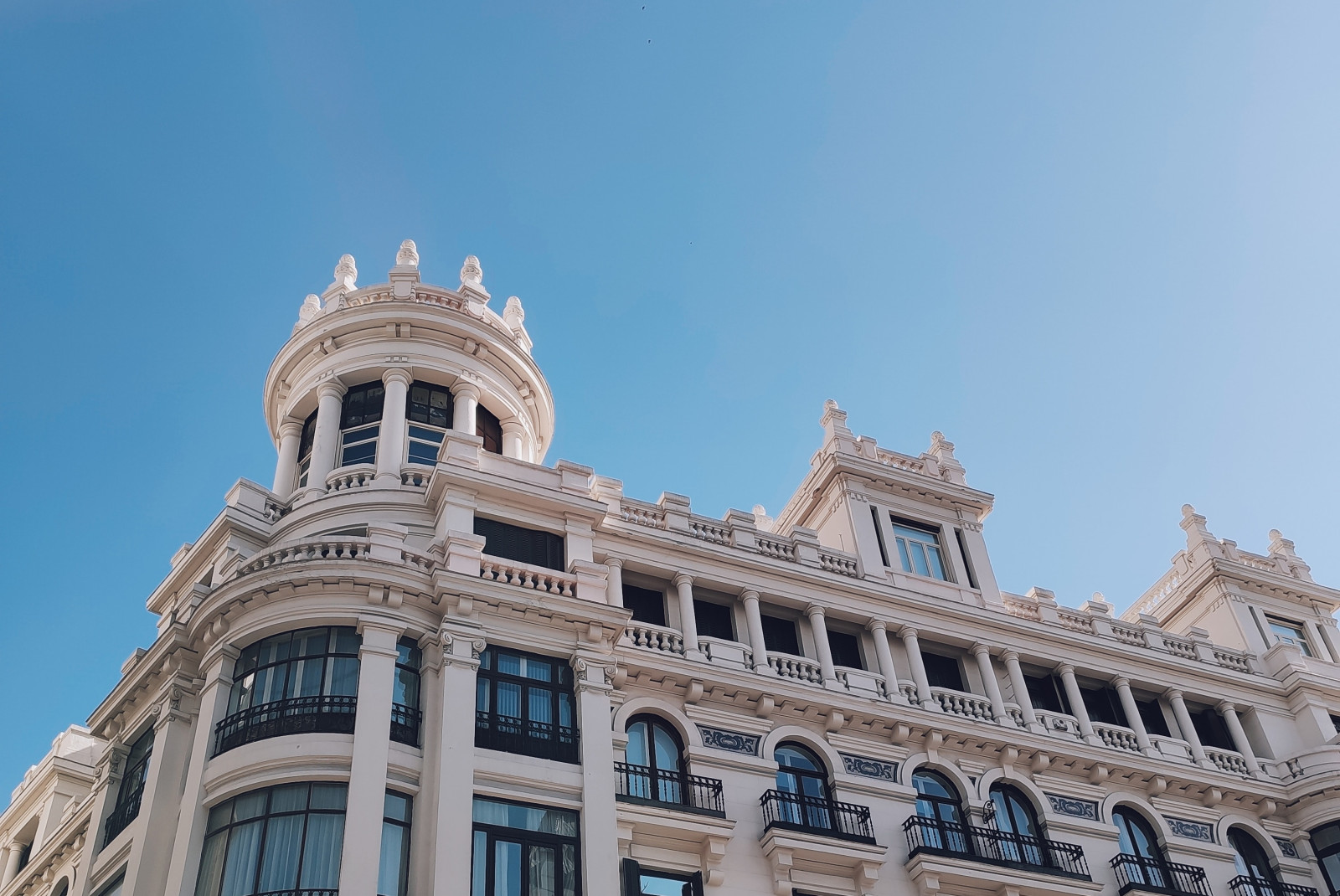 A white building with blue sky in Madrid, Spain.