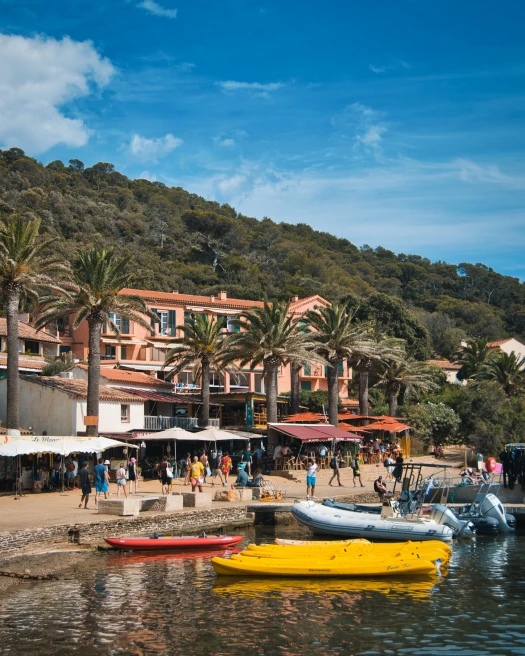 Boats and people on the shore of Port-Cros, Hyères, France