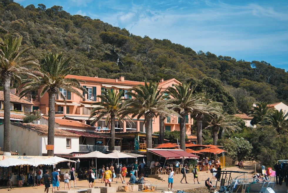 Boats and people on the shore of Port-Cros, Hyères, France