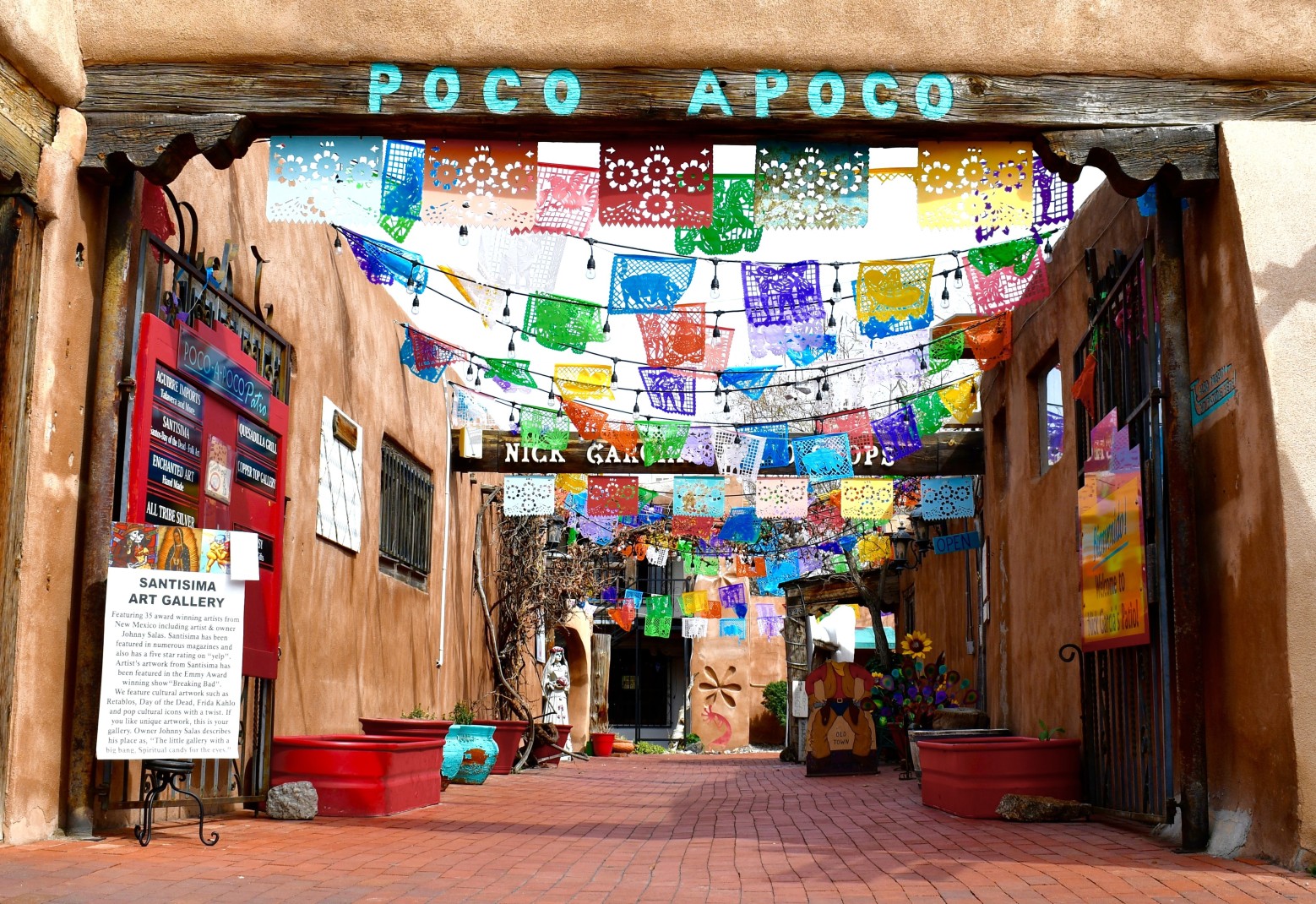 Street in Old Town Albuquerque, New Mexico with colorful flags hanging overhead