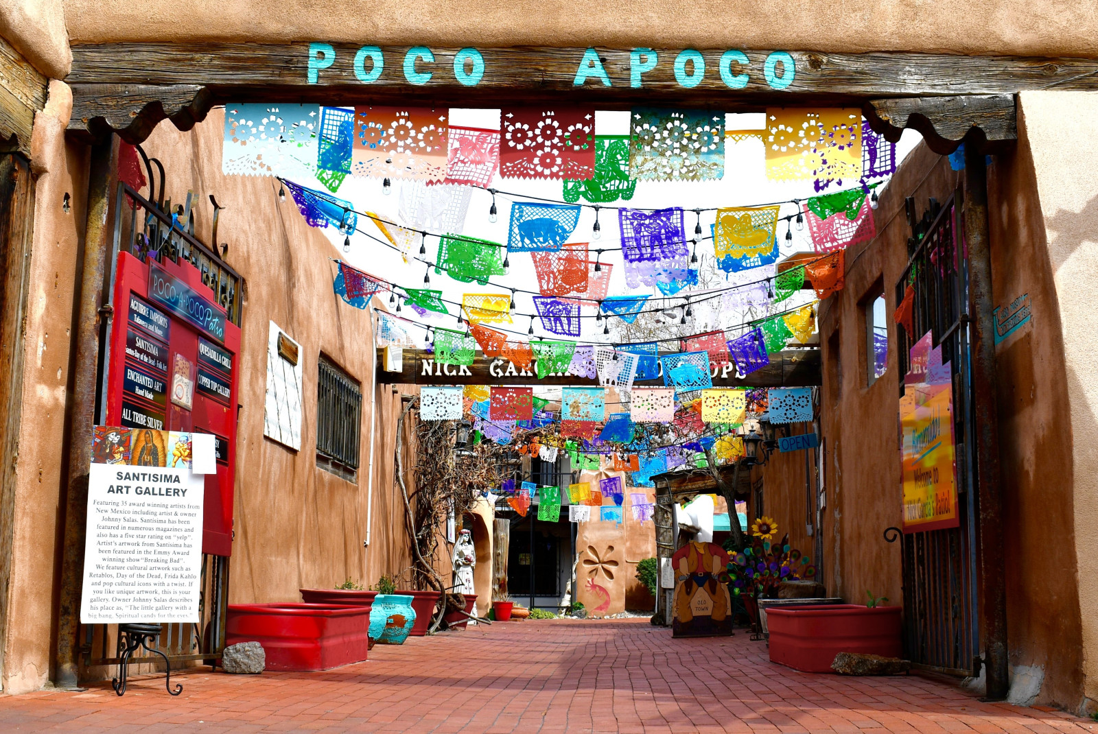 Street in Old Town Albuquerque, New Mexico with colorful flags hanging overhead