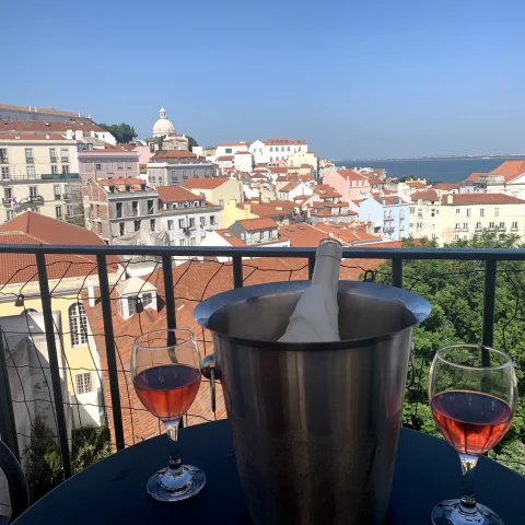 A nice glass of wine and the views of Lisbon in the distance. 