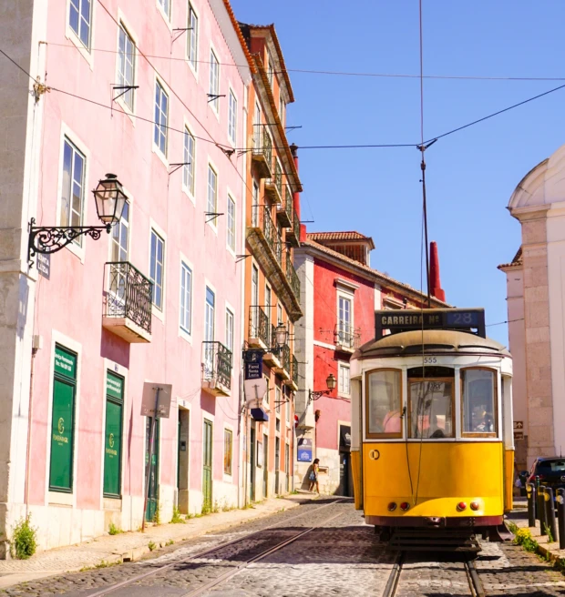 colorful houses and a yellow train car 