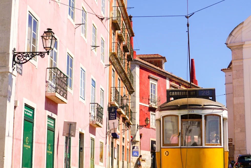 colorful houses and a yellow train car