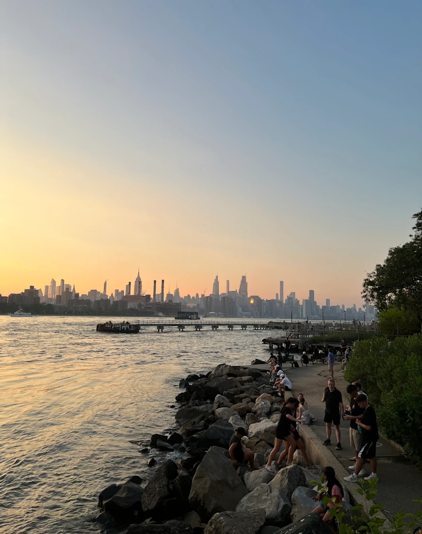 a city on a river at dusk