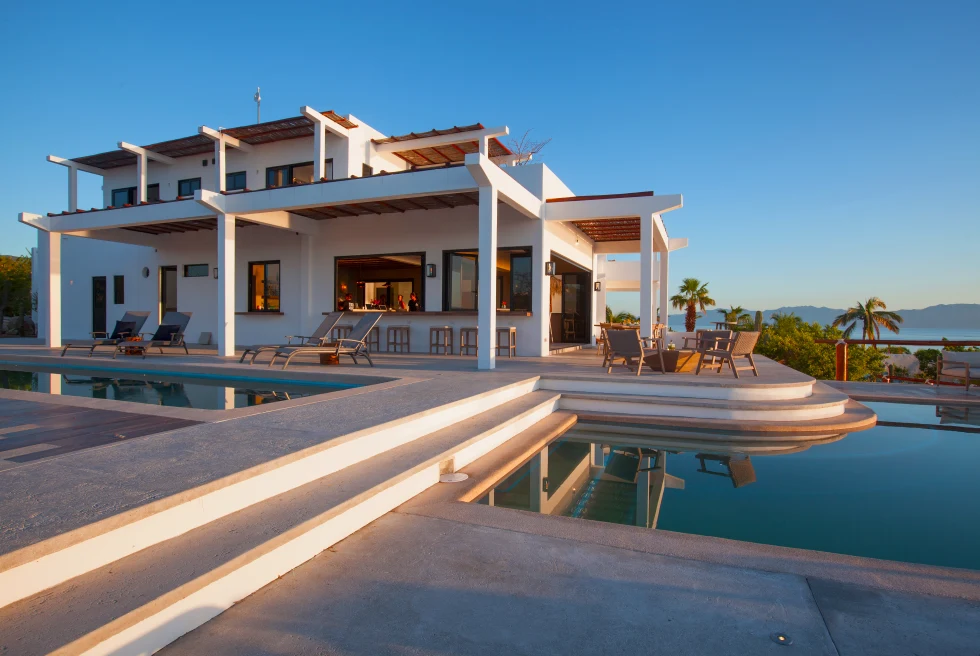 white building next to a pool during daytime