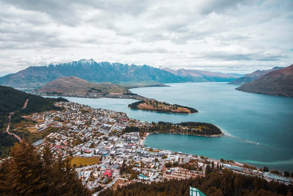 View of ocean, mountains and city in Queenstown, New Zealand