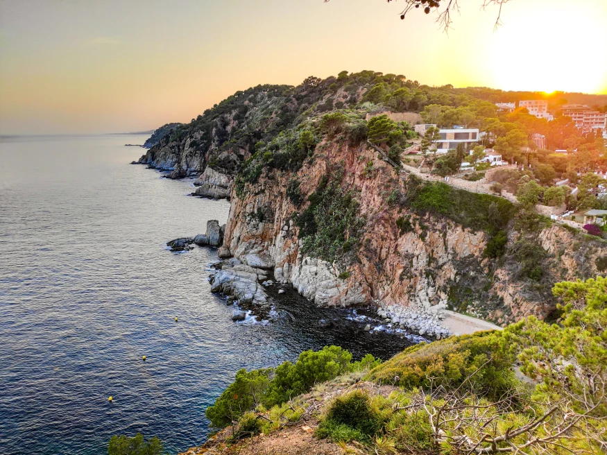 A seaside cliff in Costa Brava, Spain at sunset.