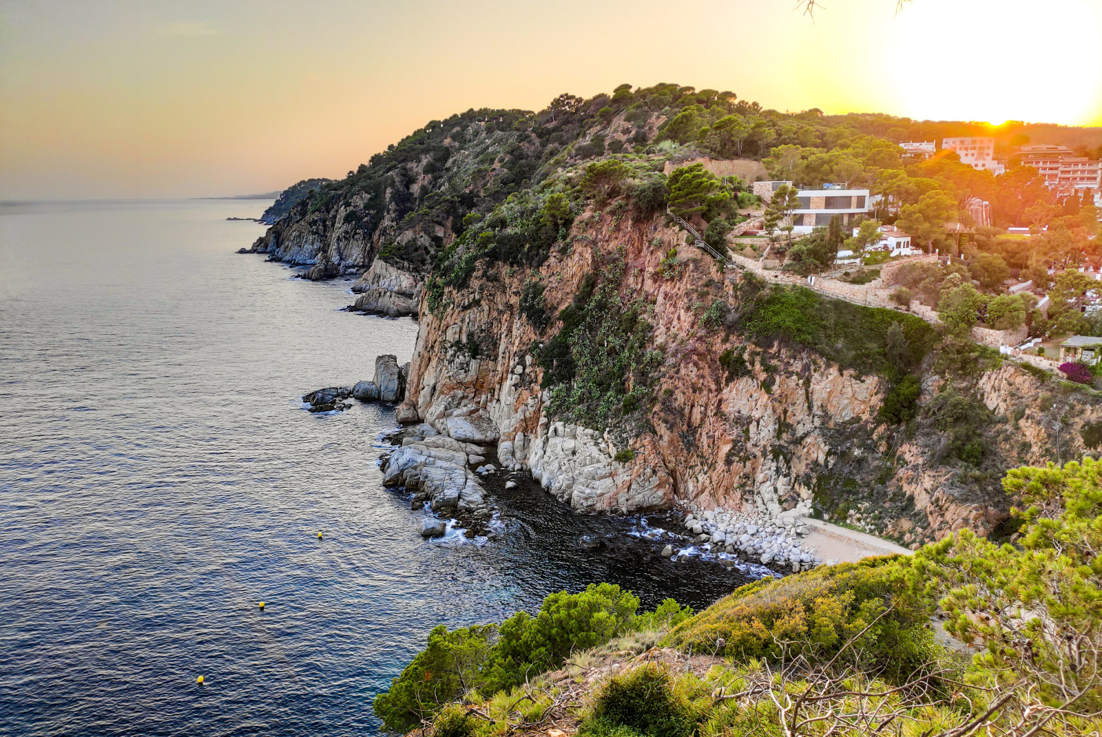 A seaside cliff in Costa Brava, Spain at sunset.