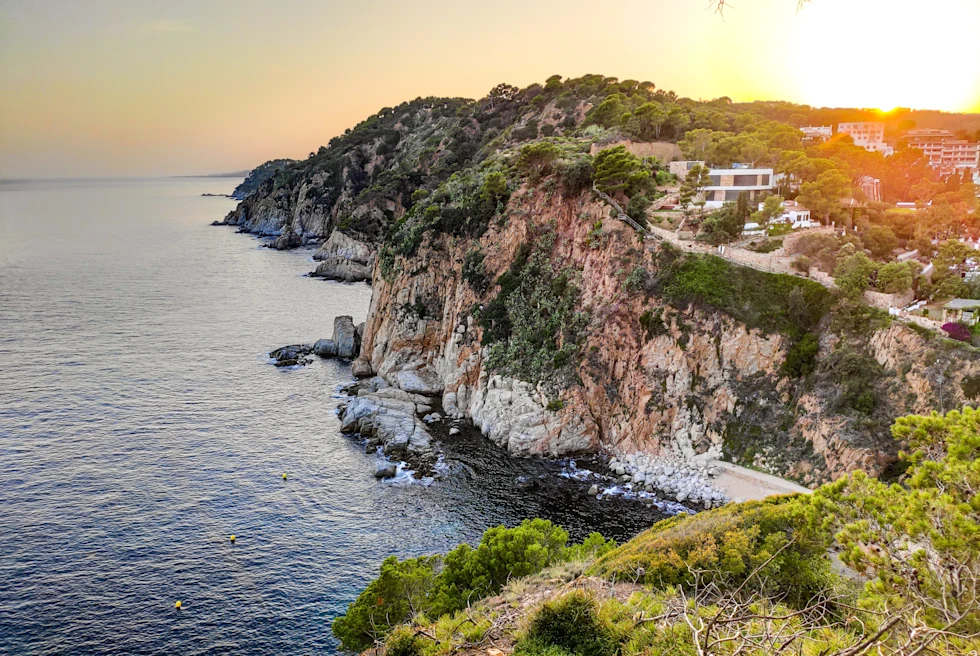 A seaside cliff in Costa Brava, Spain at sunset.