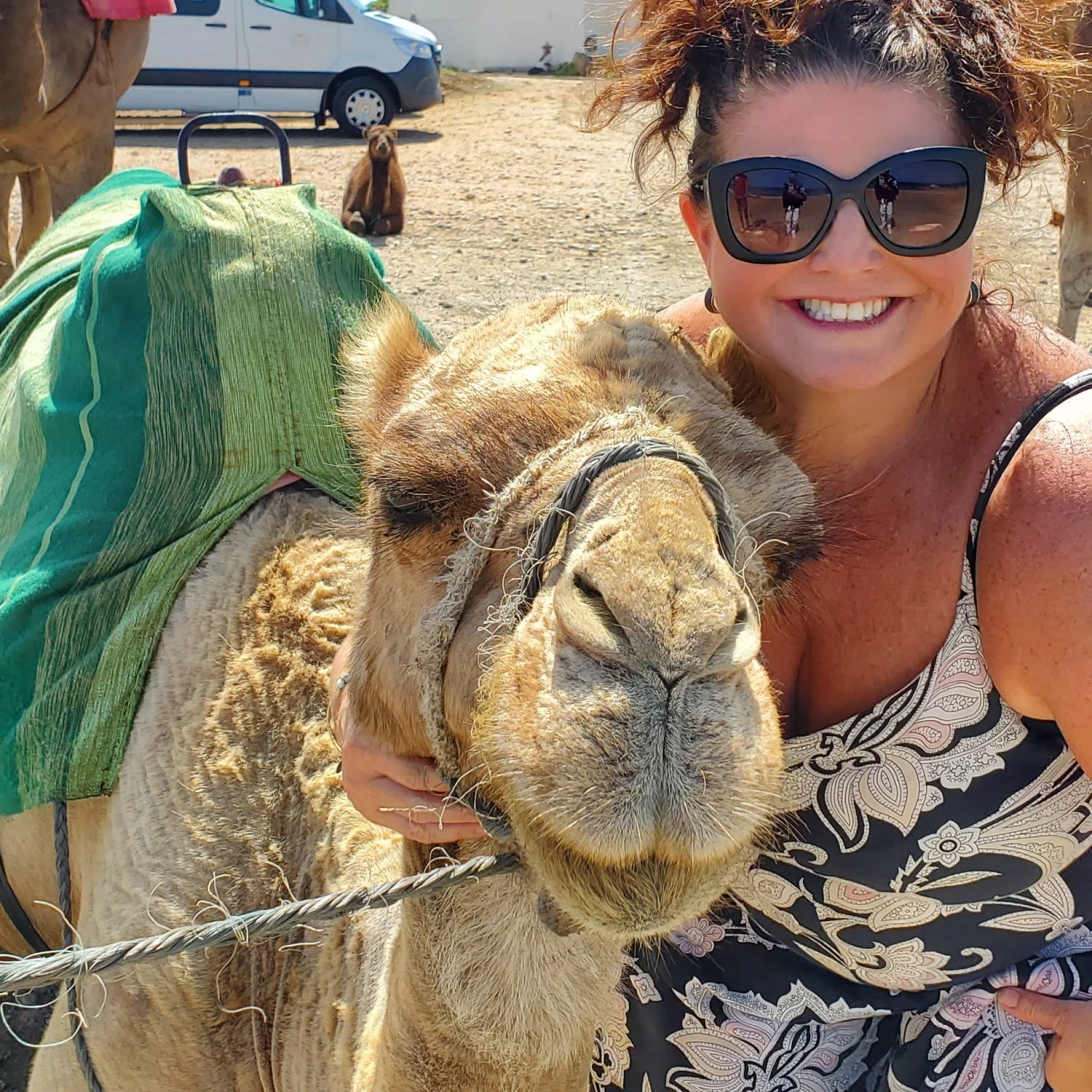 Travel advisor posing with a camel