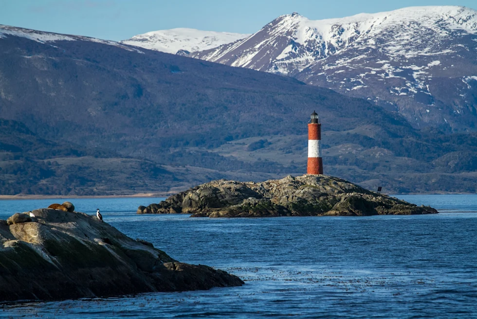 A red and white lighthouse in Ushuaia, Argentina.