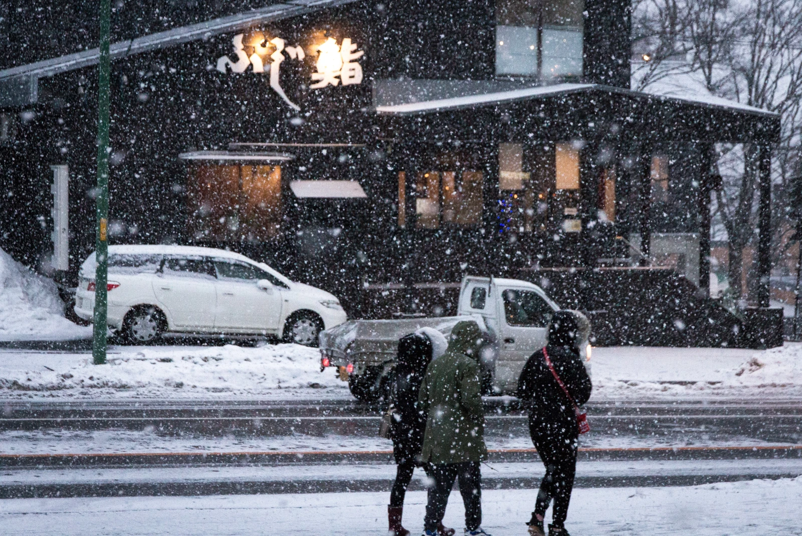 People walking on streets during snowstorm