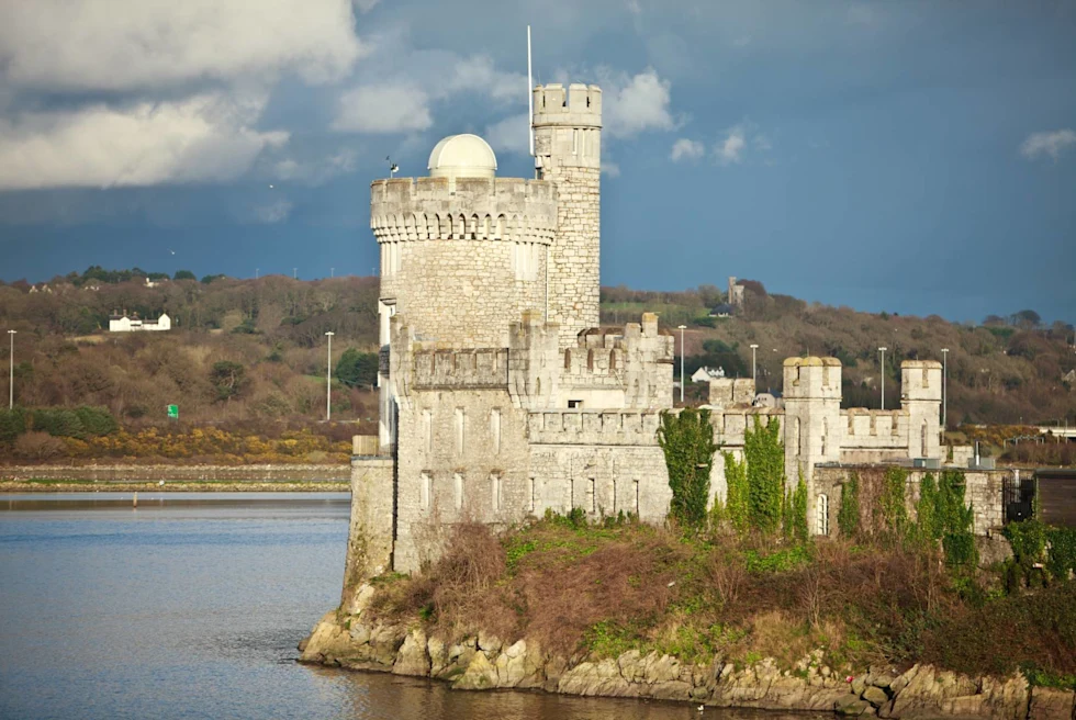 castle on a river in Ireland.