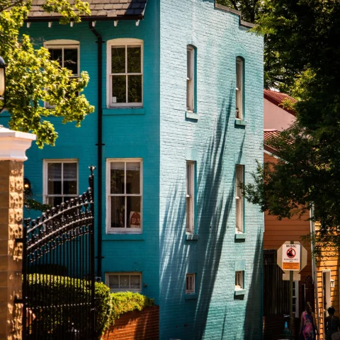  blue house on a cobblestone street