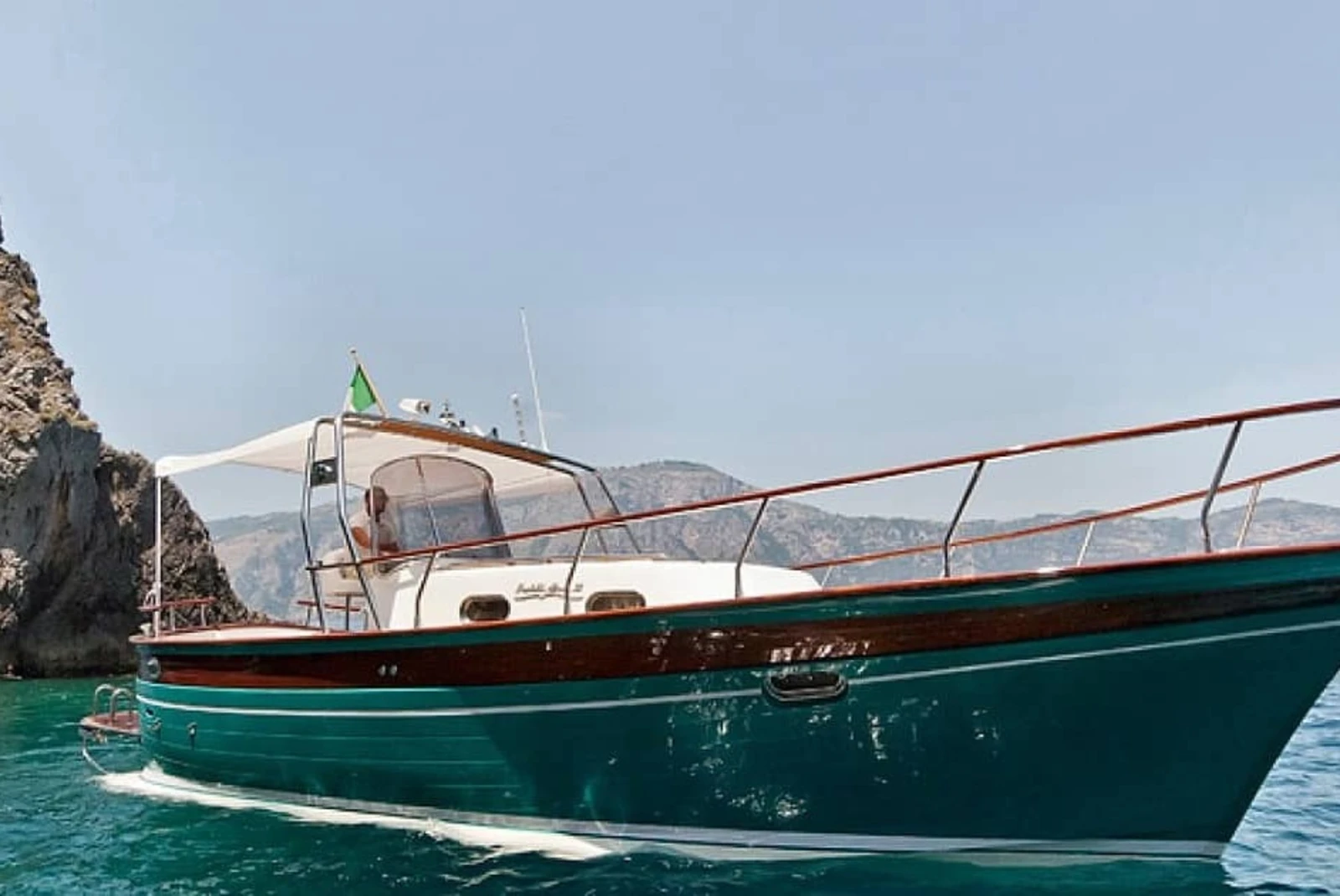 Explore the coasts of the island aboard a private Italian gozzo boat.