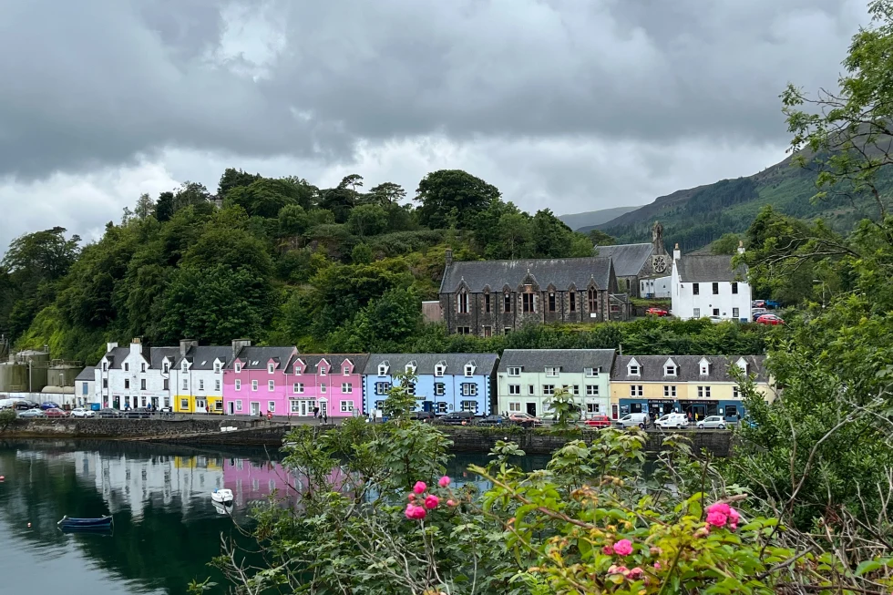 Portree Harbour is a colorful and bustling fishing village harbor on the Isle of Skye, offering stunning vistas of rugged landscapes and serene waters.