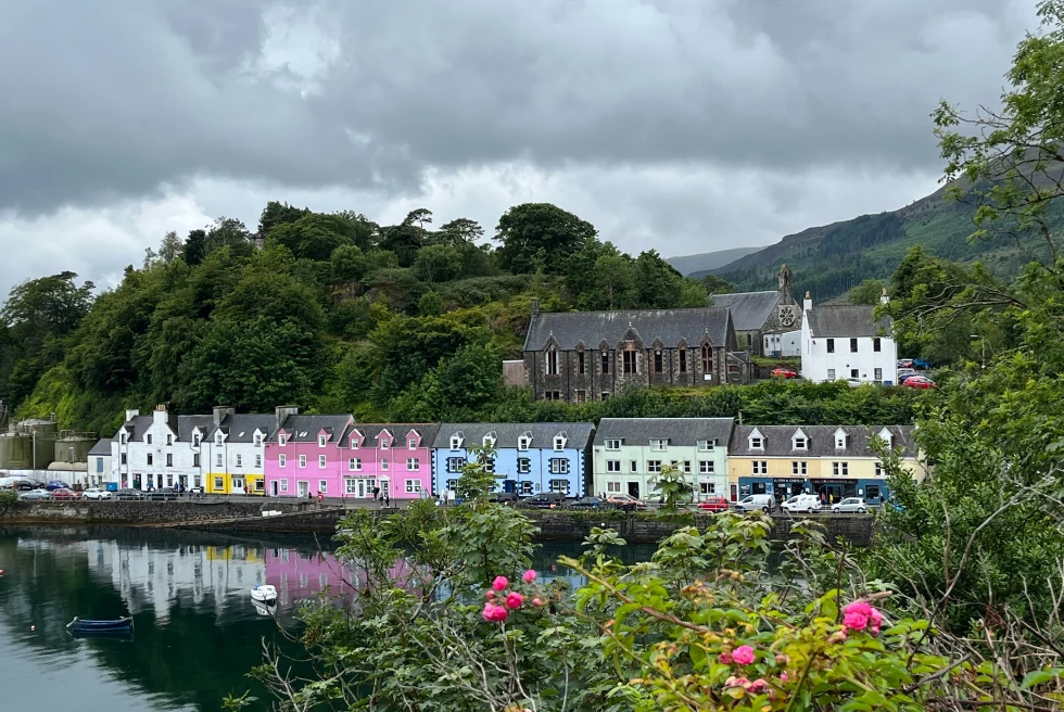 Portree Harbour is a colorful and bustling fishing village harbor on the Isle of Skye, offering stunning vistas of rugged landscapes and serene waters.
