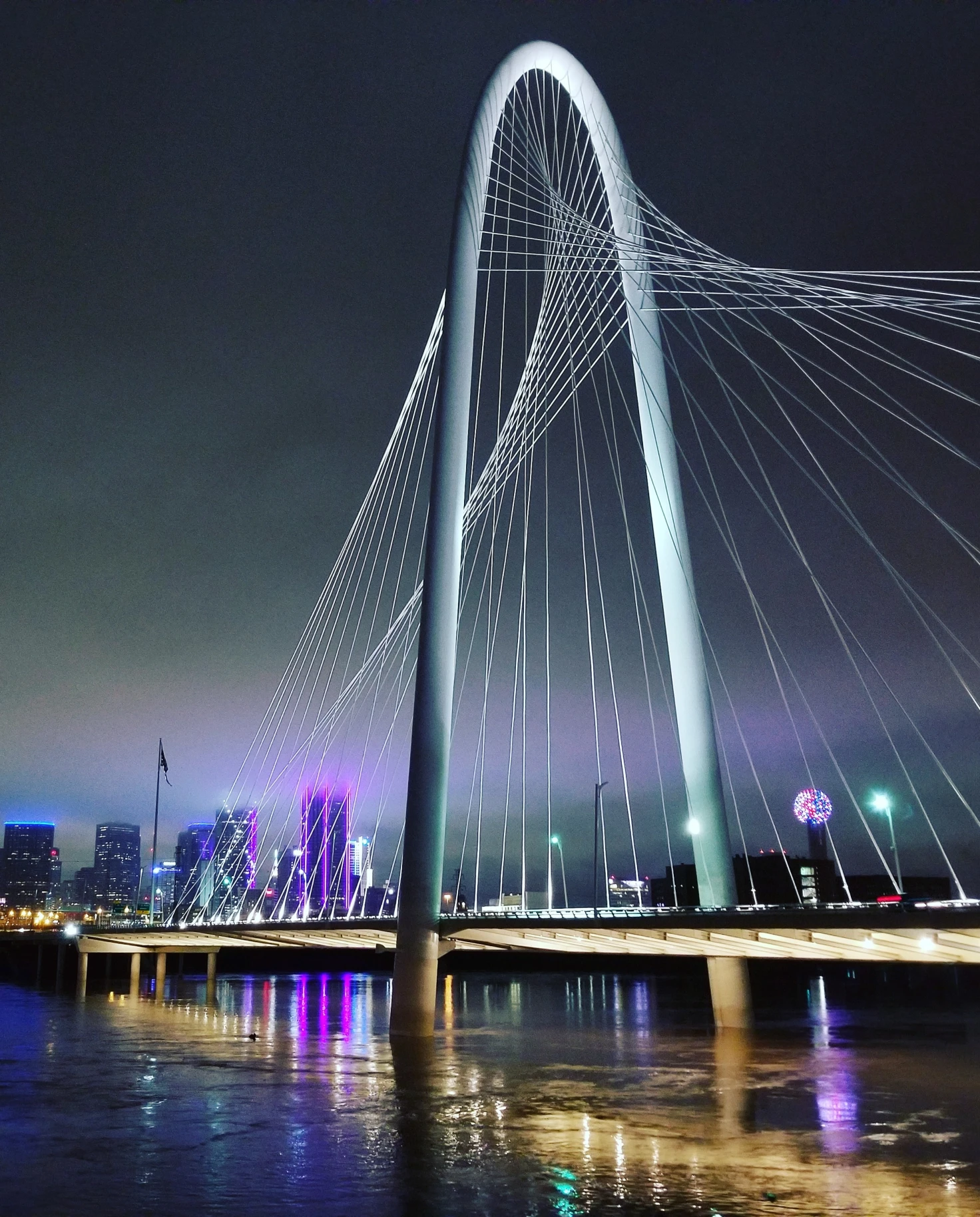 The Ronald Kirk Pedestrian Bridge is a stunning architectural landmark spanning the Trinity River in Dallas, Texas, offering pedestrians and cyclists picturesque views of the city's skyline.