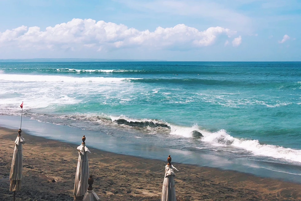 beach with closed white umbrellas