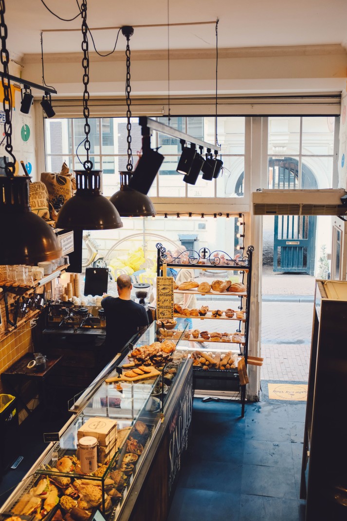 Bakery with case of baked goods during daytime