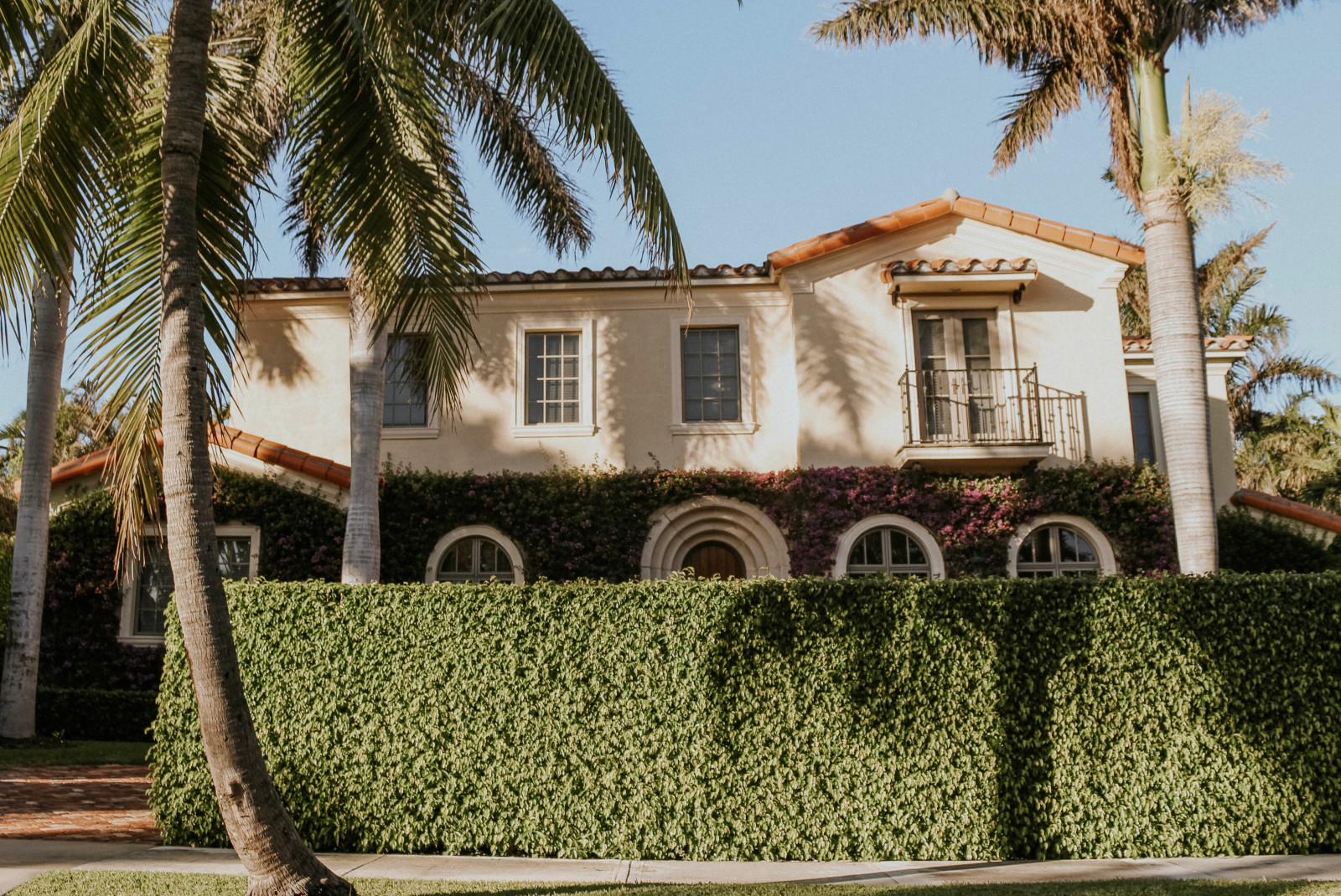 Swanky house with palm trees in Palm Beach. 