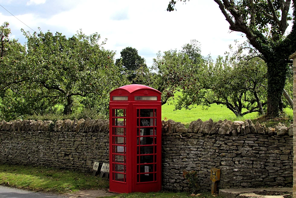 A telephone booth picture in the daytime.