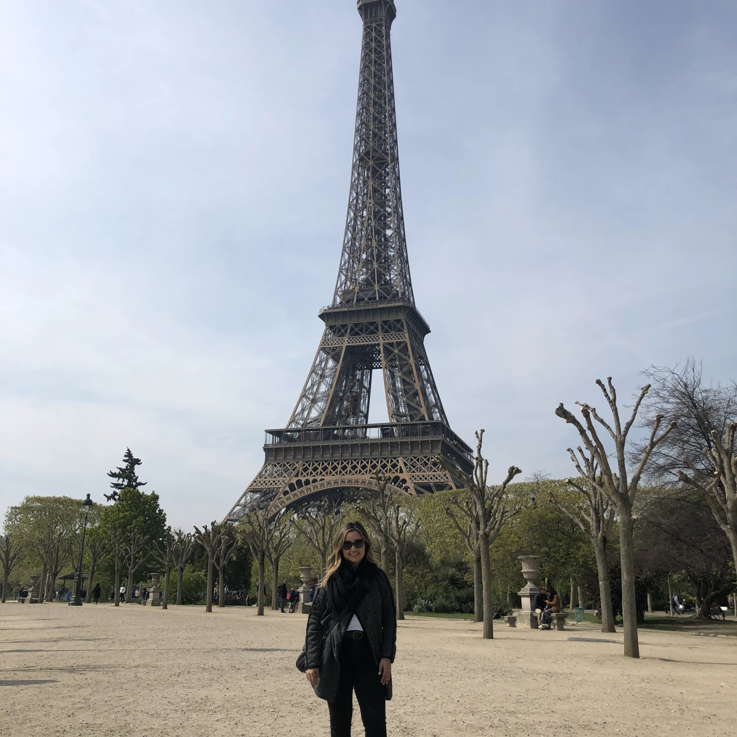 Travel advisor posing in front of Eiffel Tower