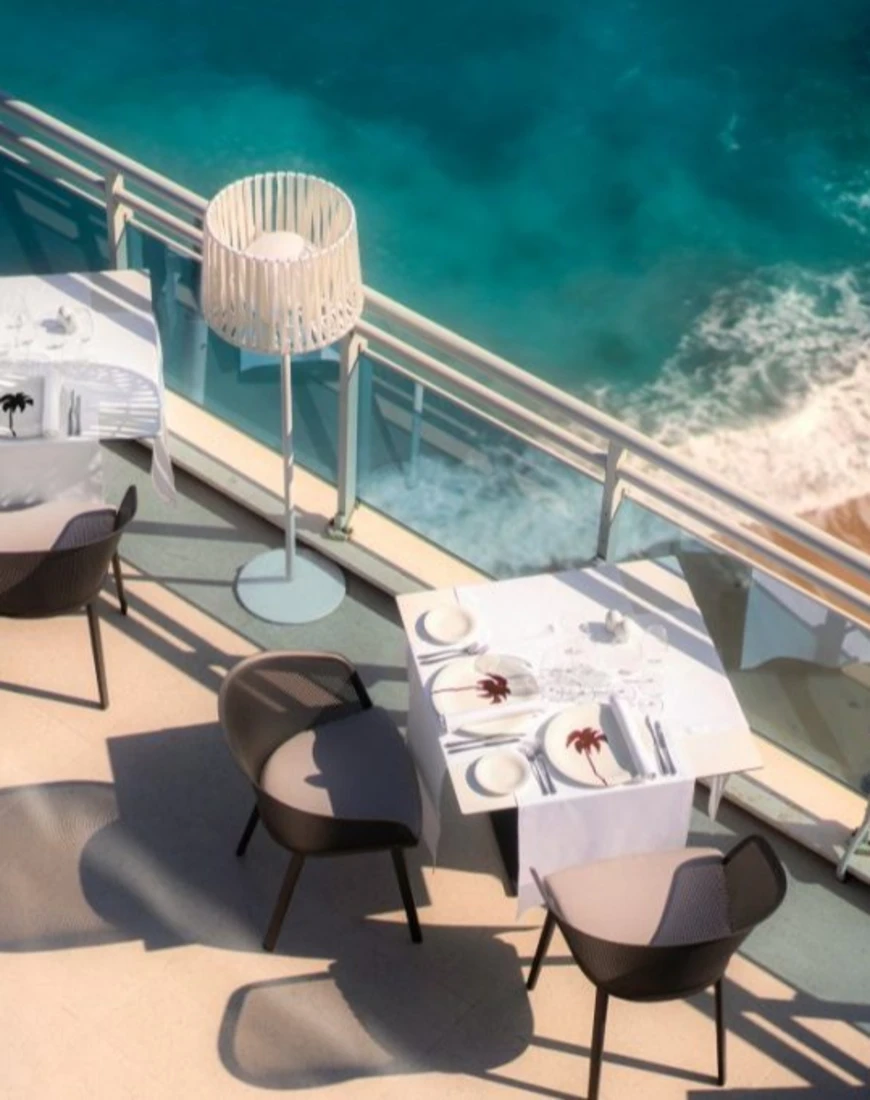 terrace dining tables overlooking beach and sea in Dubrovnik Croatia