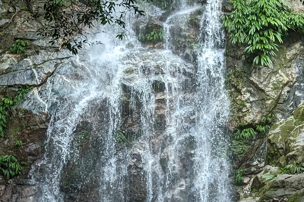 A waterfall against rocks. 