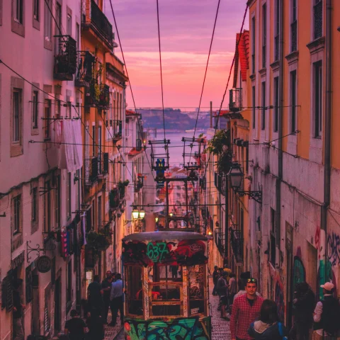 People Walking Between Buildings
