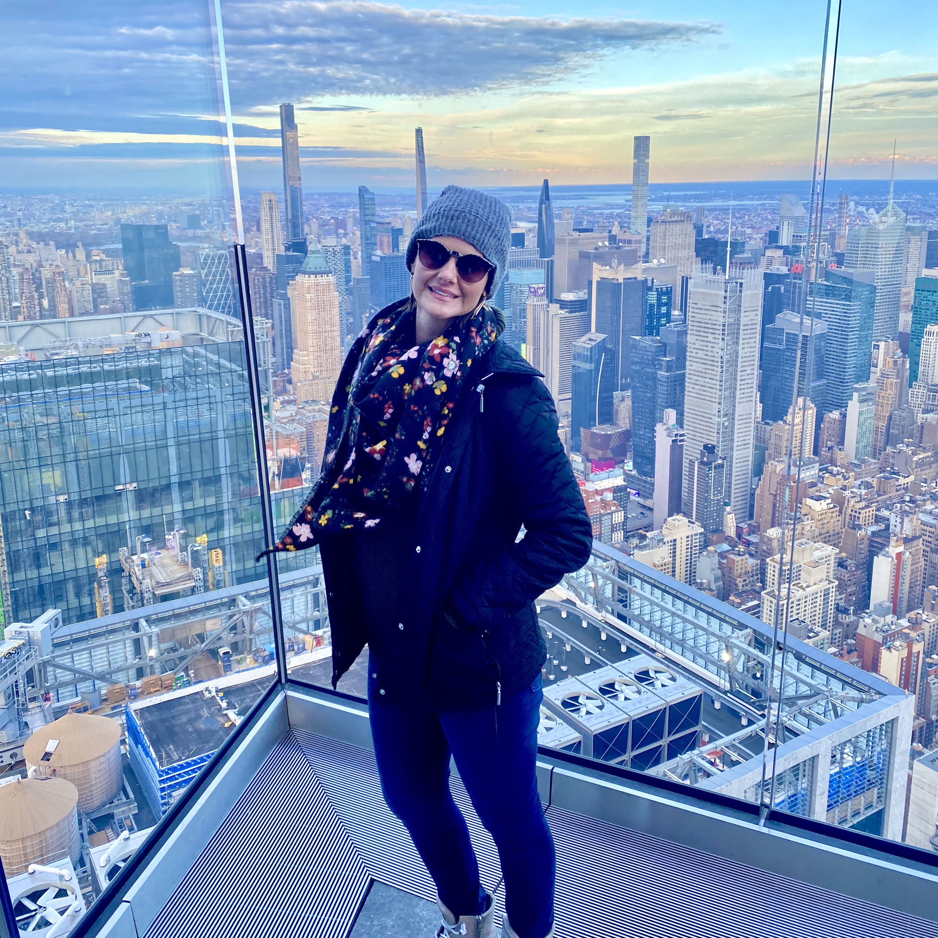 Tara posing with builiding in the background