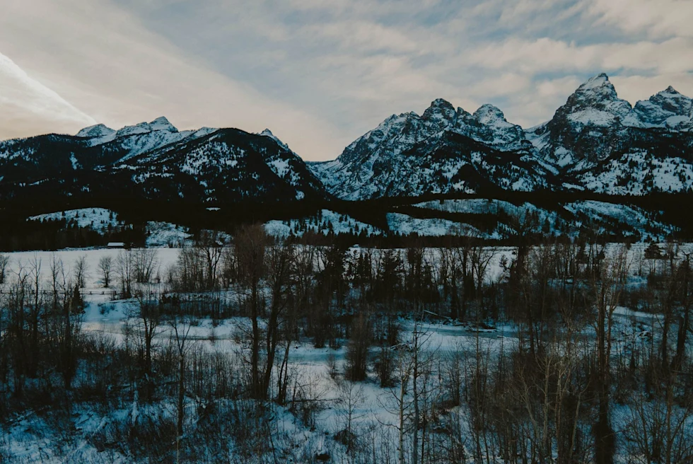 A snowy landscape with mountains