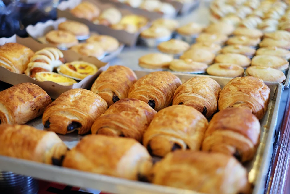 Close up of bakery items on trays.