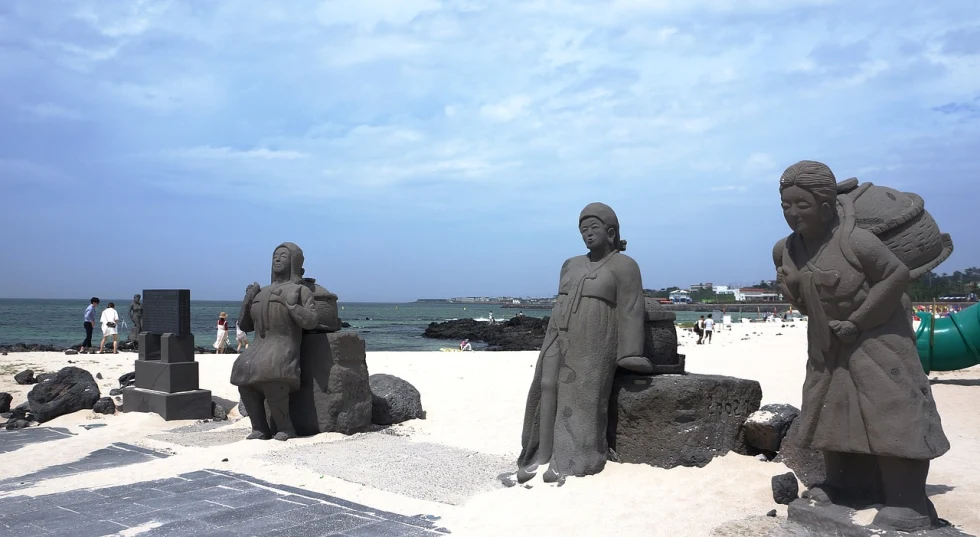 A beach with statues.