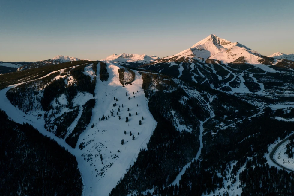 Snow-capped Big Sky mountain in Montana at sunset.
