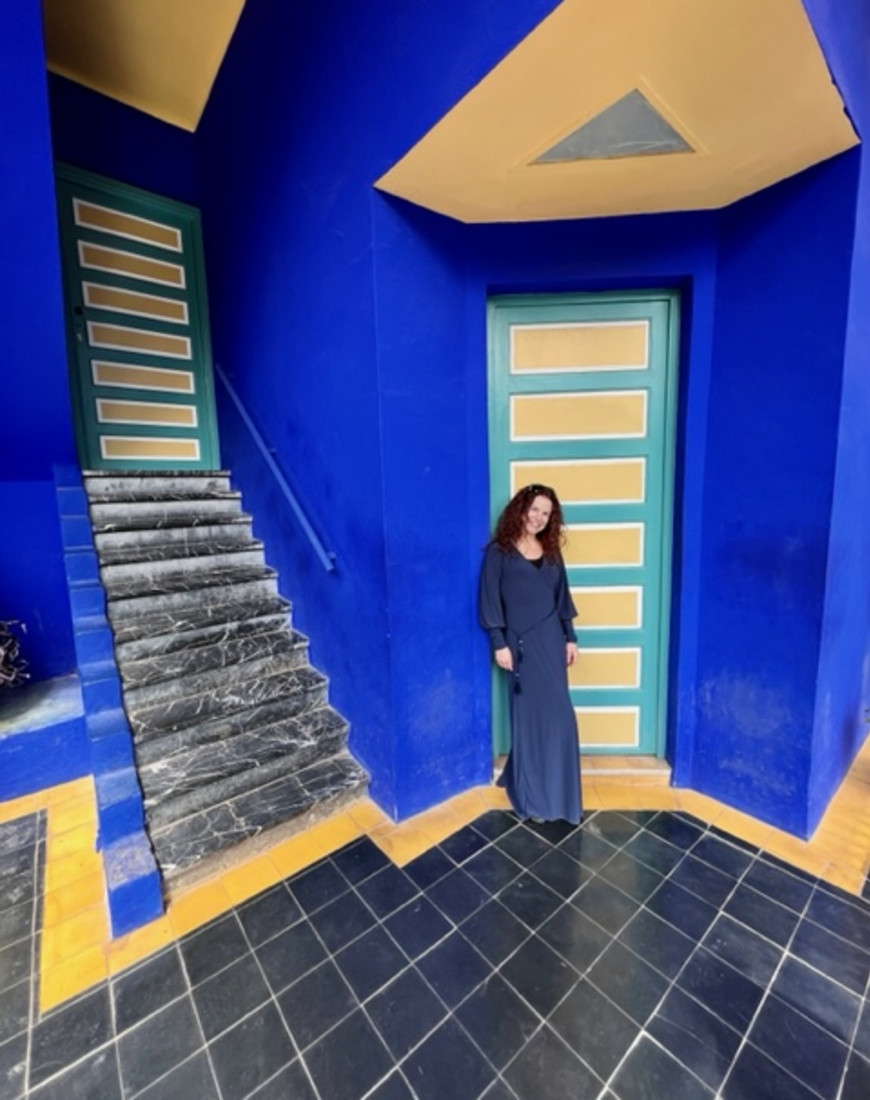 Woman posing in front of a door