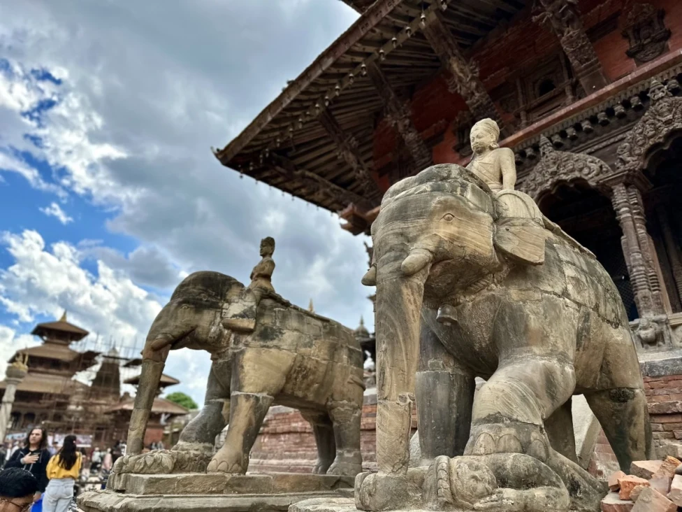stone elephant statutes underneath a temple