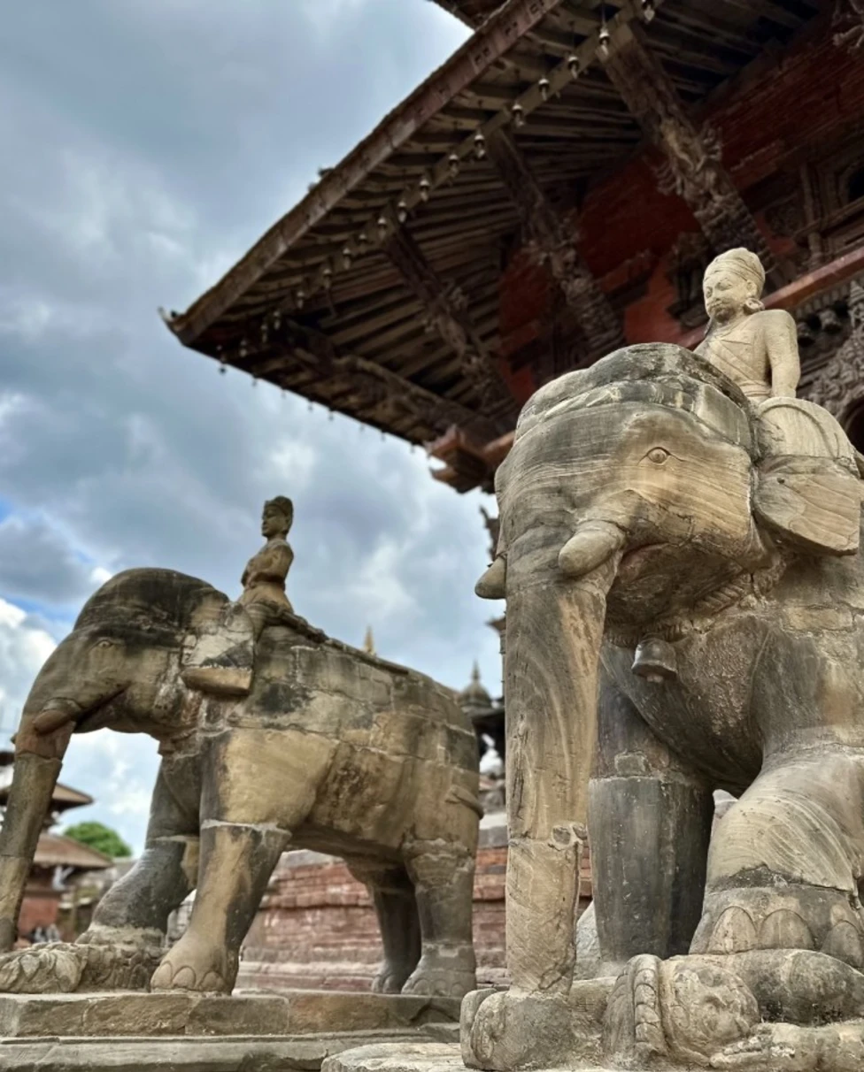 stone elephant statutes underneath a temple