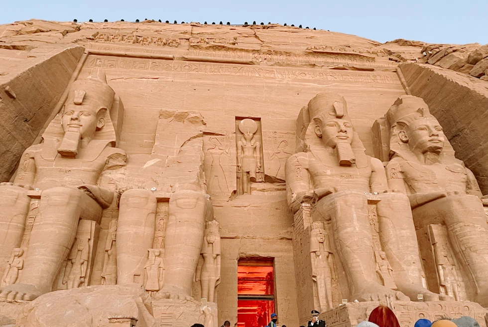 Large statues carved on the outside of tall building in Egypt