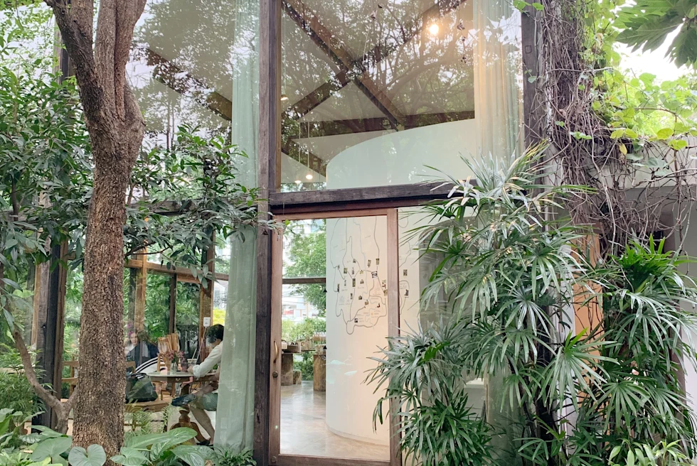 building with large windows next to trees during daytime