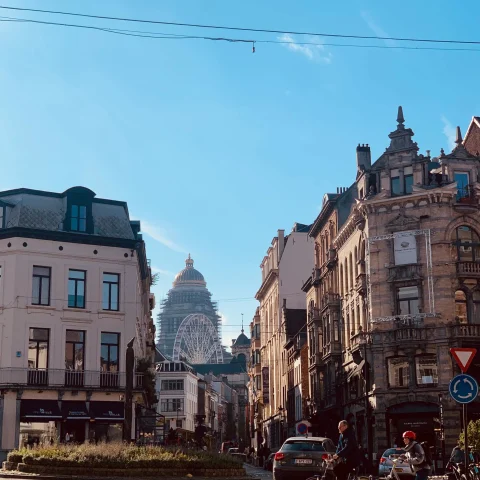 view from an intersection at the top of a city with blue cloudless sky