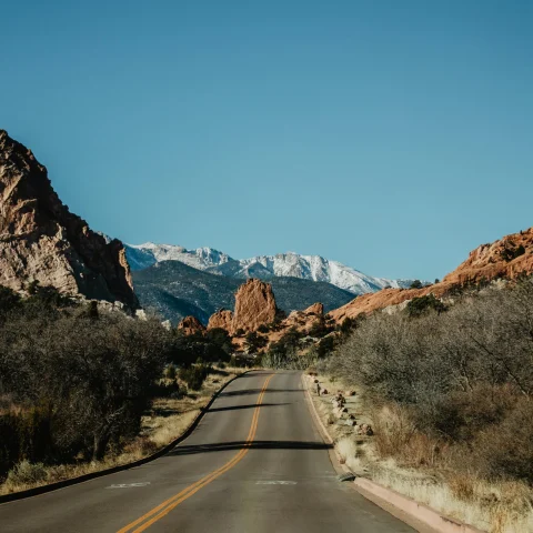 scenic road amid a red-rock mountain range