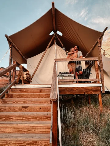 Couple posing in a tent house