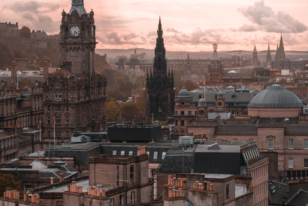 A city view of Edinburgh at sunset.