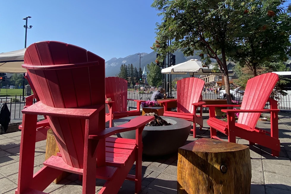 Red colored chairs placed in day light